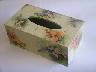 Finished decoupage decor arranged on a studio table