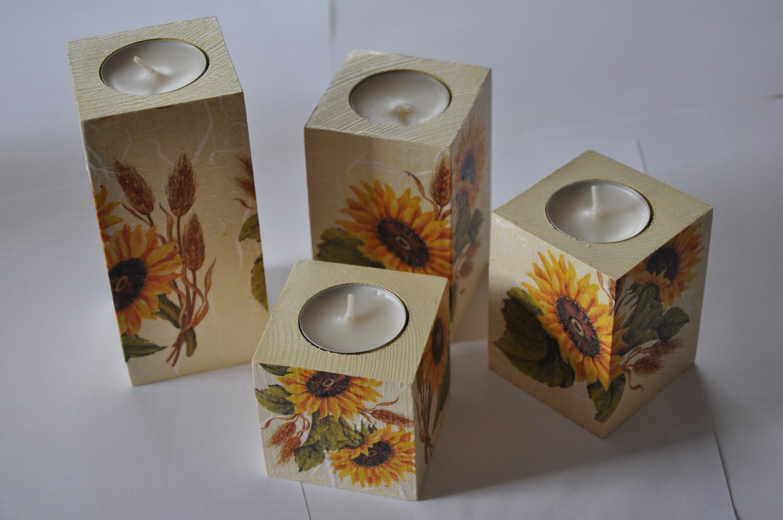 Decoupage artist layering paper onto a wooden box